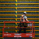 A technician inspects the backside of bitcoin mining operation.